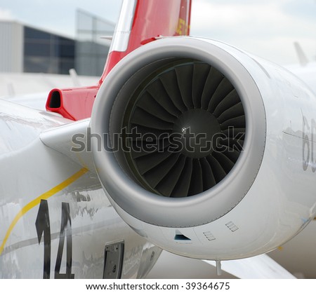 Close front view of a tail mounted jet engine on a corporate jet