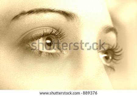 sepia picture of girl eyes looking gently