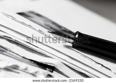 ld-fashioned fountain pen and letter, focus on pen, black and white