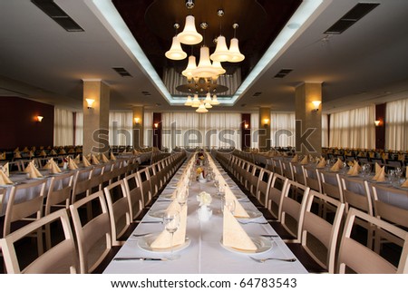 Interior photo, long table and chairs in a row