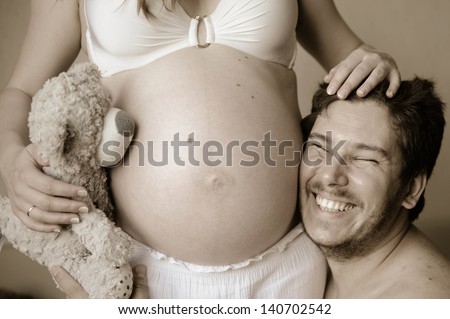 Husband Hugs His Pregnant Wife