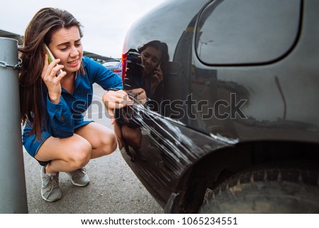 woman stand near scratched auto. call for help. car insurance