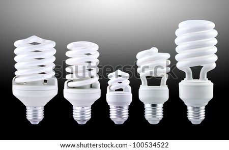 Fluorescent light bulb group isolated on gray background.