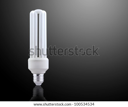 Fluorescent light bulb isolated on gray background.
