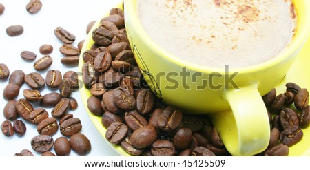 cacao beans and cup with coffee