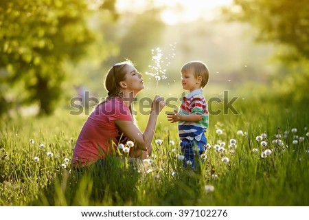 With mommy and dandelions