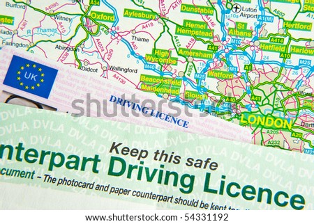 UK driving license on UK road map around London