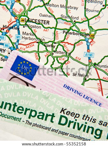 UK driving licence on UK road map around London