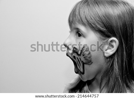 Girl with painted face with fish print side view black