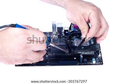 Two man`s hands soldering fee, computer motherboard repair isolated white