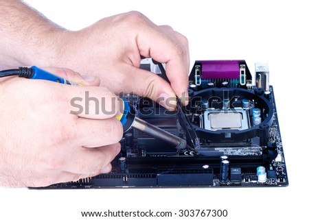 Two man`s hands soldering fee, computer motherboard repair isolated white