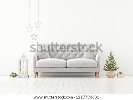 Living room interior wall mock up with grey tufted sofa, fur pillows, lantern and decorated christmas tree on empty white background. 3D rendering.