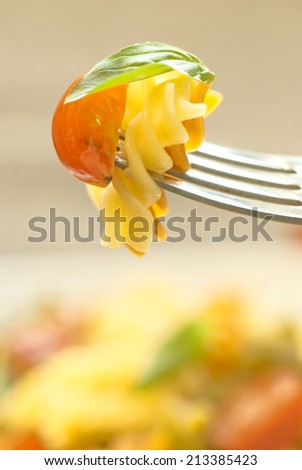 Italian food. Pasta fusilli with tomato and basil