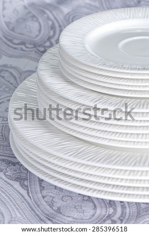 empty clean plates on grey background