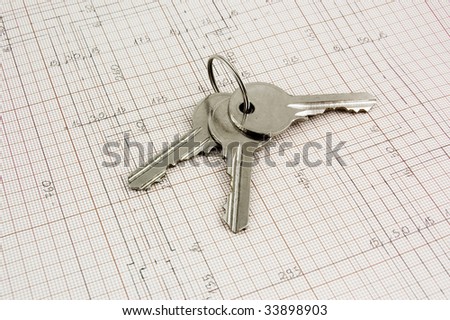 Photo of a keys on a building plans.