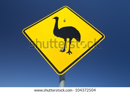 Australian Emu warning sign against a vibrant blue sky