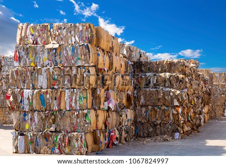 Stack of paper waste before shredding at recycling plant
