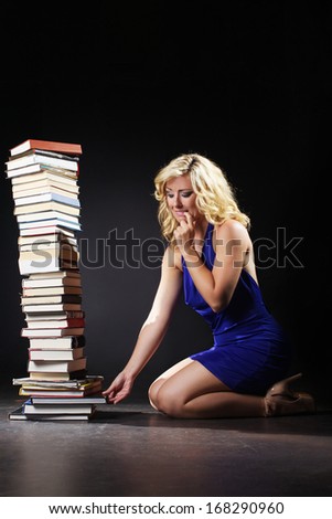 The beautiful woman is tray take a book
