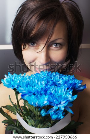The beautiful woman with violet bouquet