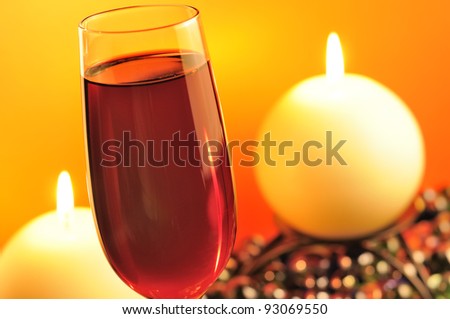 Romantic Dinner in Restaurant with Red Wine and Burning Candles