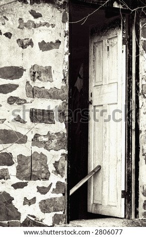 Black and white version - old farm door propped open