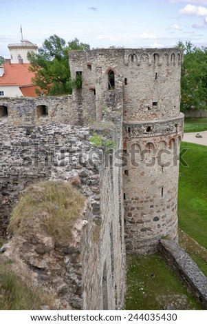 Stone ruins Vedensky castle in the town of Cesis on the background of blue sky