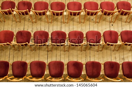 Empty rows of chairs in the concert hall
