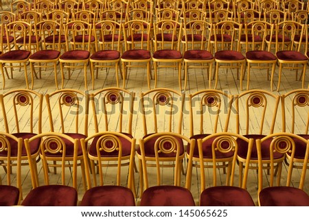Empty rows of chairs in the concert hall