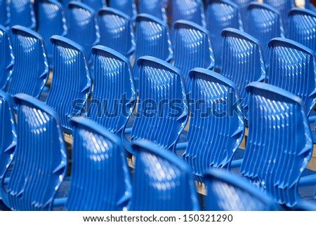 Empty rows of chairs, seats in the concert hall, in the sports hall