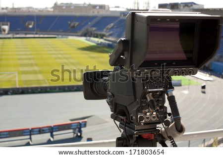 TV at the soccer.  video camera back football goal