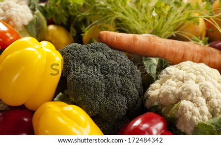 Assorted grocery products including vegetables fruits wine bread dairy and meat  products on the kitchen table vegetables on a kitchen table