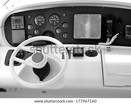 yacht marine equipment,  Instrument panel and steering wheel of a motor boat cockpit