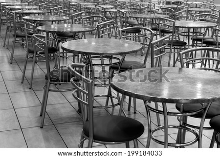 An empty cafeteria interior shot. tables formally set