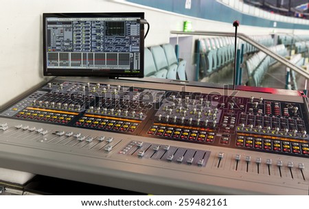 sound studio adjusting record equipment
console sound engineer