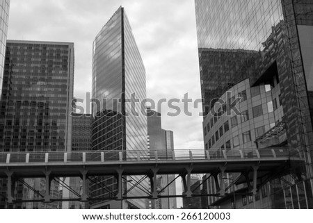 Business skyscrapers, sunny blue sky. La Defense financial distr.\
black and white photo