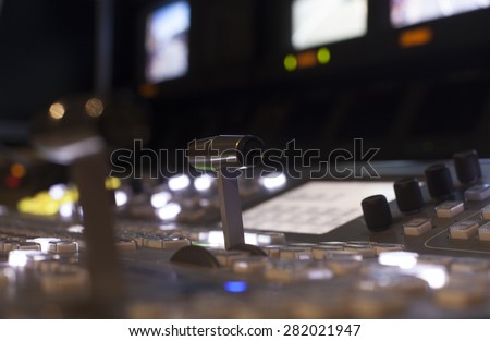Television Broadcast Gallery \
Wide shot of vision mixing panel in a television gallery.\
\
button on the control panel television equipment