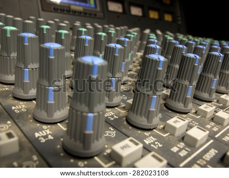 sound studio adjusting record equipment console sound engineer