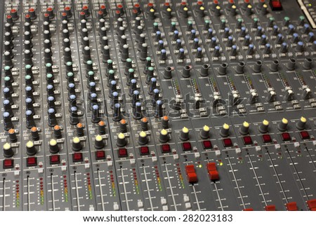 sound studio adjusting record equipment console sound engineer