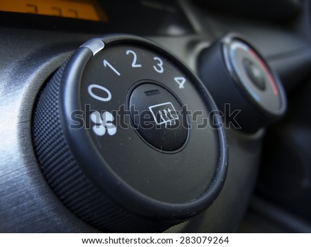 close-up of car  button. Modern car interior with dashboard and cockpit details