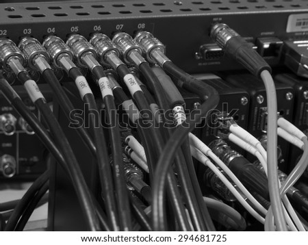button on the control panel television equipment. black and white photo