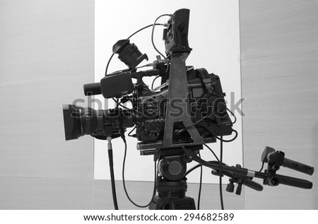 tv camera in a concert hal. Professional digital video camera. black and white photo