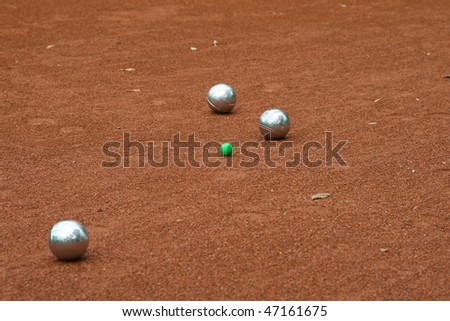 Silver boccia balls on the ground