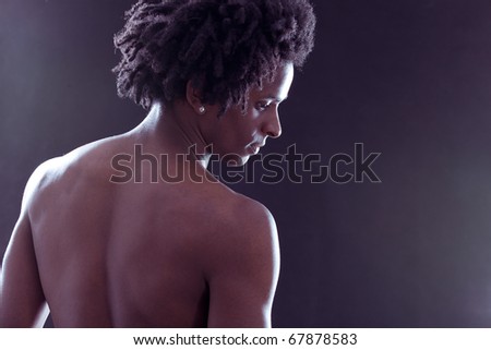 stock photo Beautiful naked african man looking at the floor