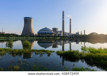 Coal-fired power plant reflection in a lake , industry landscape