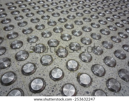 Closeup of marble  flooring with metal anti slip