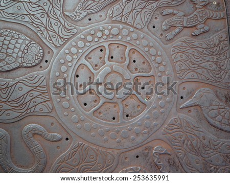 Closeup of metal deck with aboriginal art