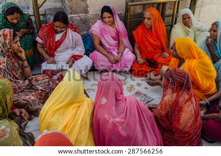 JAIPUR-MARCH 04 :women preparing for religious celebration in the street on March 04, 2014 in Jaipur,india