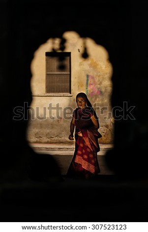 AGRA-MARCH 05 :woman preparing for a religious ceremony in the street on March 05, 2014 in Agra,India