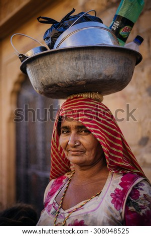 JAISALMER, INDIA - MARCH 22 : Indian woman poses in the street on March 22 , 2014 in Jaisalmer, India