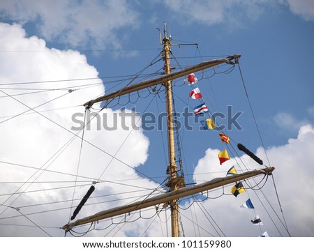 Color photo of mast sailing ship in the sky